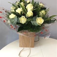 12 White Roses Handtied in a Bag