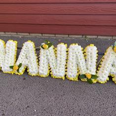 A Traditional Blocked Nanna Single rose per letter